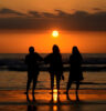 Bule foreigners at sunset on a beach in Bali