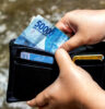 Tipping in Bali- Guide | Holding Indonesian Rupiah e